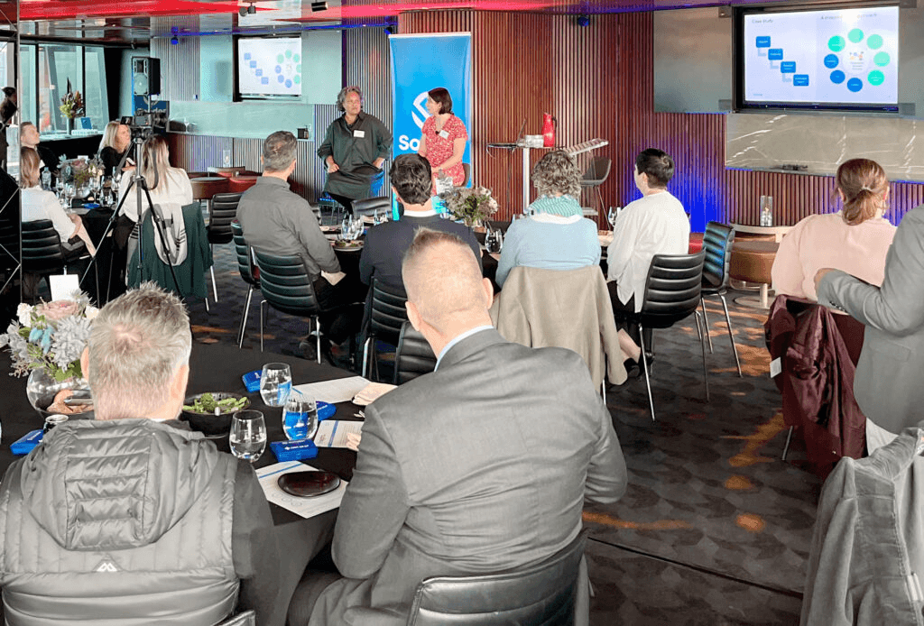 Bec Goulter presenting at a Sonder industry event in Melbourne, with attendees seated at tables.